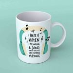 I hate it when I'm singing a song coffee mug