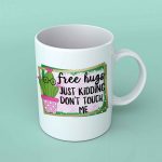 Free hugs just kidding coffee mug