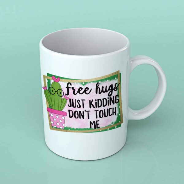 Free hugs just kidding coffee mug